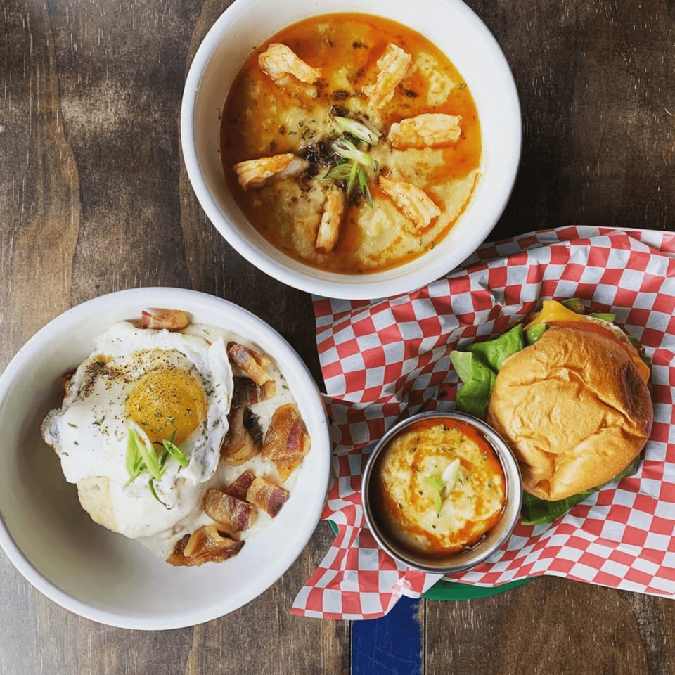 Shrimp and grits, biscuits and gravy with a fried egg, and a burger with a side of grits.
